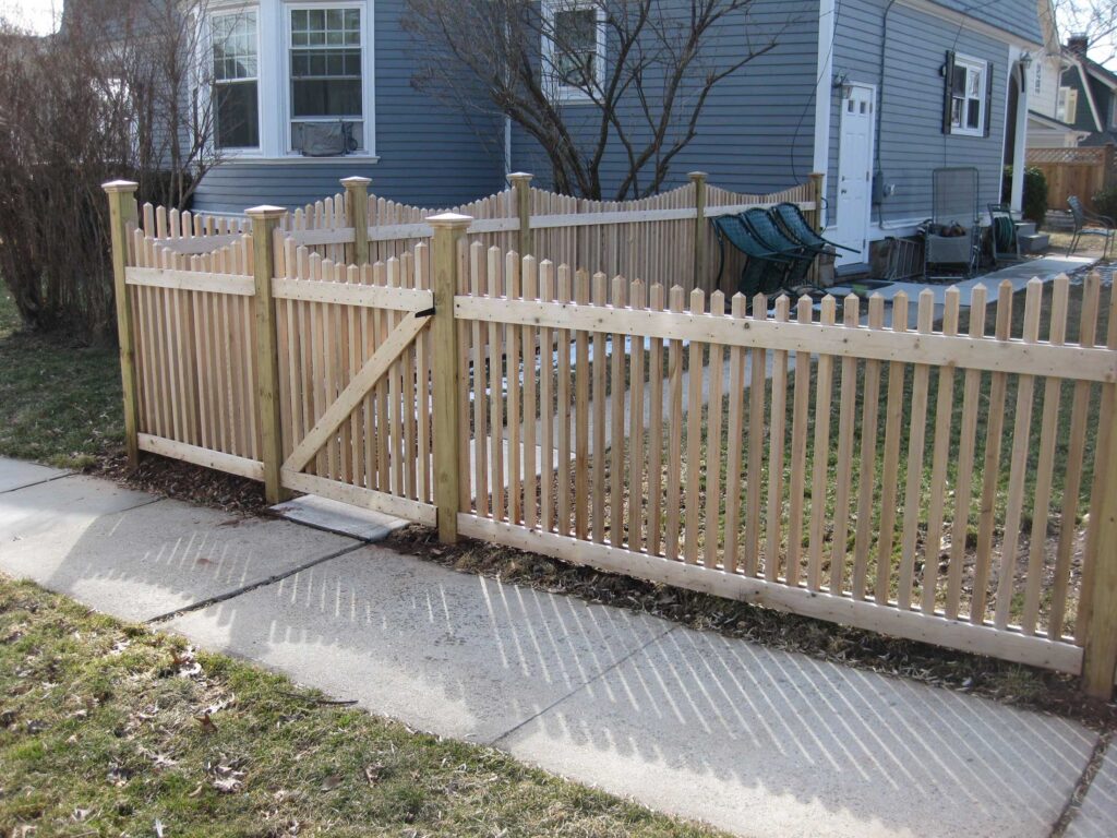 scalloped spindle fence with gate